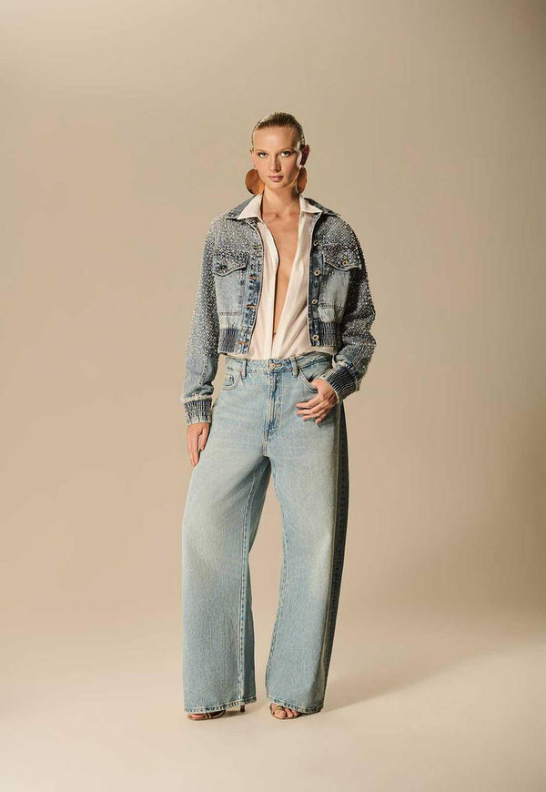 CALÇA JEANS BOLSO LARGO DETALHE PERNA